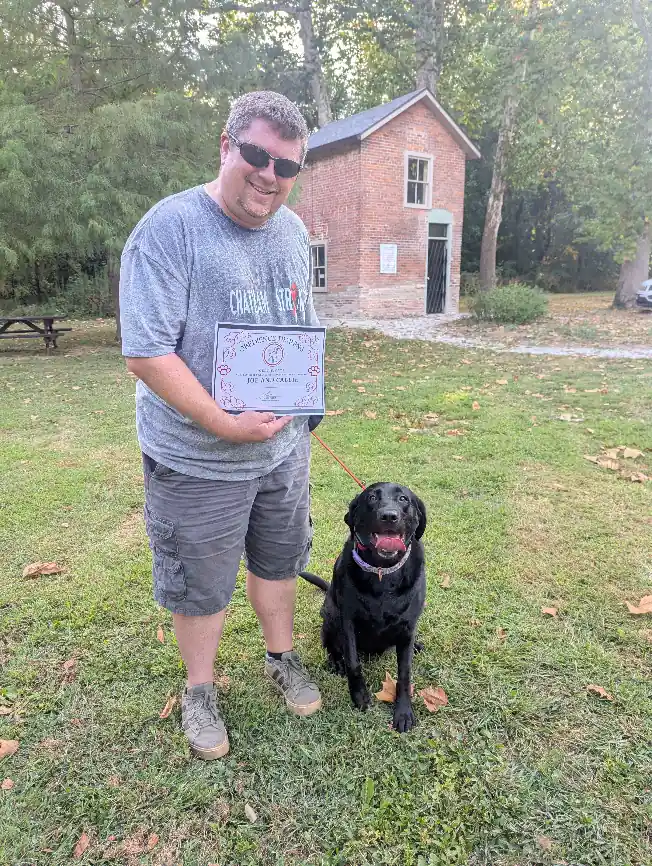 Joe and Callie with their obedience training certificate